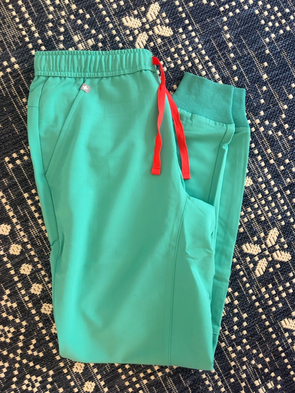 Figs: Men size small pants in Teal with Red Drawstring